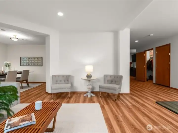 Living room flows into dining room, creating two light and airy, adjoining living spaces for entertaining