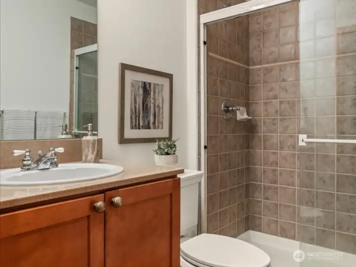 Three quarter bath, on main floor, adjacent to main floor flex/ bedroom with lovely, tiled walk-in shower
