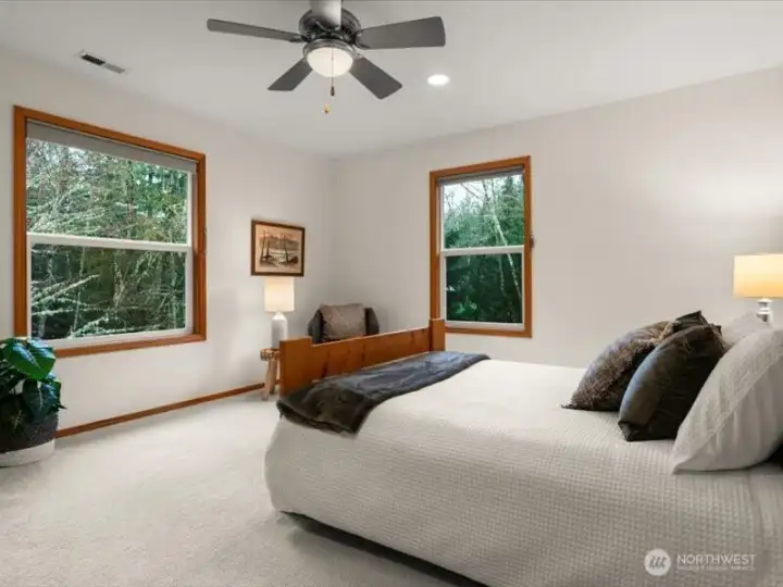 Nicely sized secondary bedroom with walk-in closet, adjacent to full bath and offers beautiful backyard views