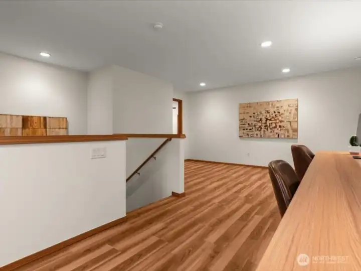 Beautiful wood-like Luxury vinyl flooring continues form lower level, upstairs and throughout upstairs hallways and primary bedroom