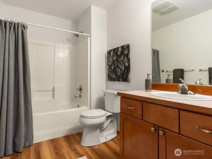 Upstairs secondary bathroom with linen closet, thoughtfully positioned across from bonus/ 5th bedroom