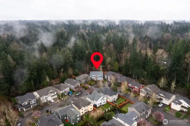 Perfectly positioned in a neighborhood setting, backing onto a lush greenbelt, on a pie shaped lot, maximizing back yard size