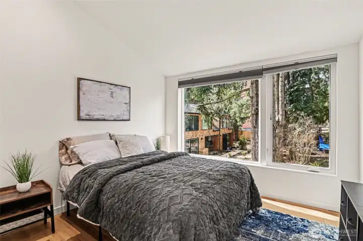 View from this upper level bedroom shows the community space around which all homes are situated.