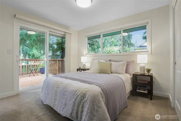Spacious primary bedroom with its own private back deck.
