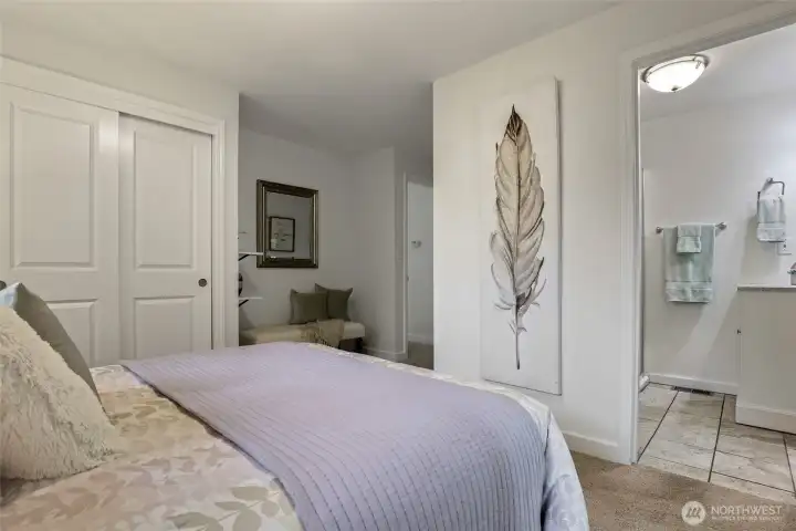 Primary bedroom with direct access to a private en-suite 3/4 bath