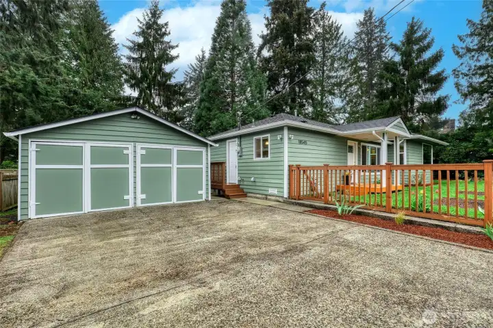 Detached two Car Garage with outbuilding workshop and additional 2-car off street parking.