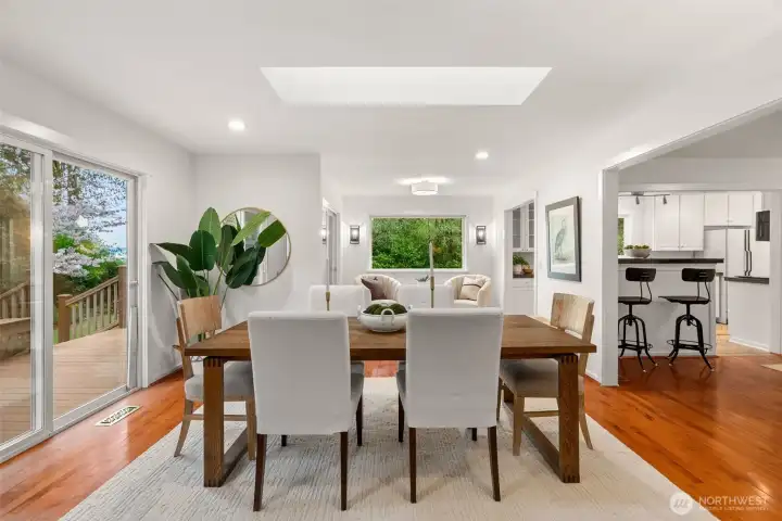 Deck to the left, perfect for indoor/outdoor dining and entertaining. See the kitchen to the right