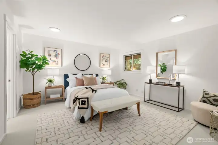 The Primary suite, with plenty of room for a sitting area, console table and nightstands.