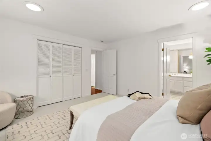 Primary suite with closet and bath to the right. Newly installed carpet and fresh paint.