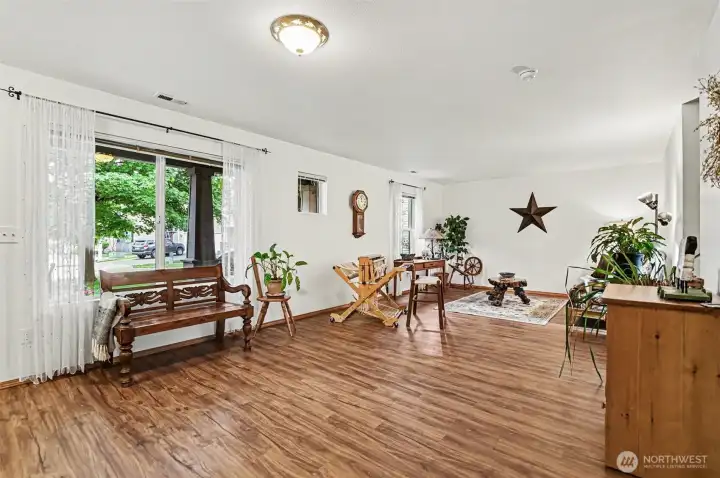 Spacious living area upon entry with large window overlooking the front lawn.