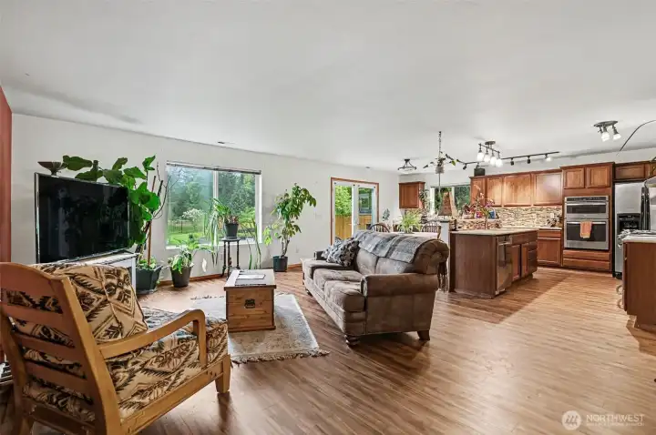 The back of the home features a great room with spacious kitchen and living area overlooking the large back yard