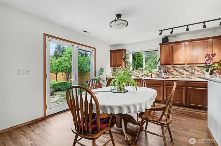 Double doors open to the level, fully fenced backyard.