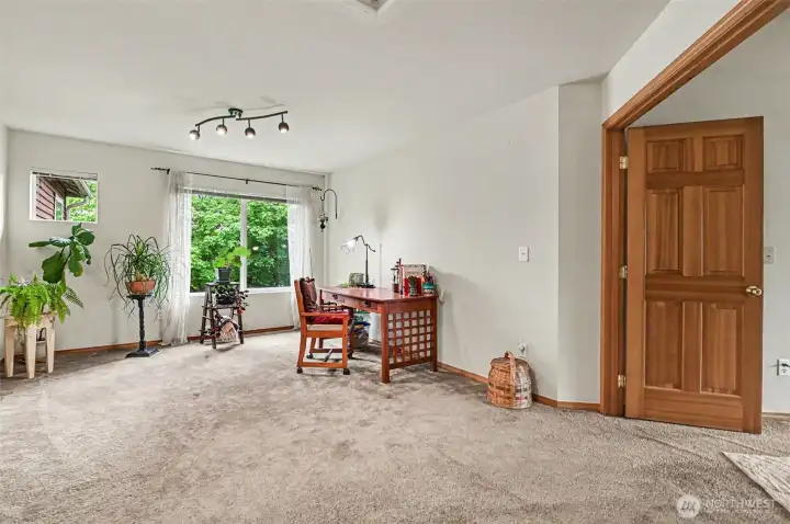 Same loft area just off the primary suite with double-doors.