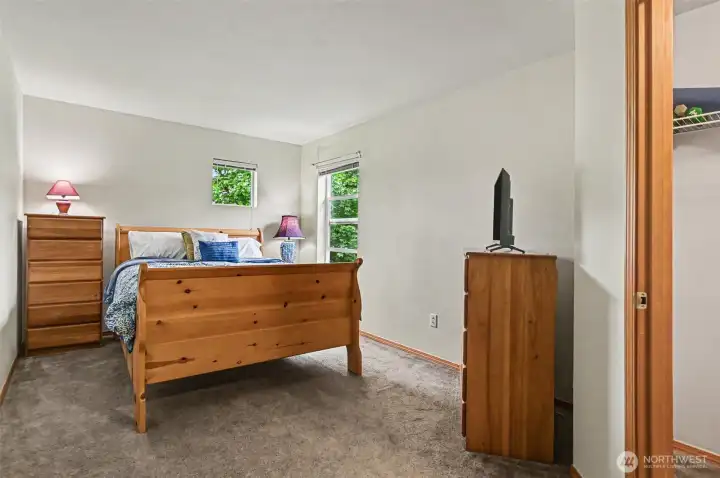 One of three guest beds on upper level, this one with a walk in closet.