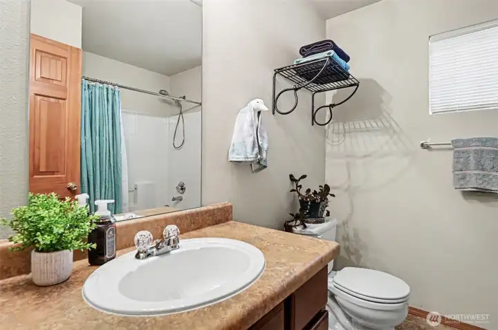 2nd of TWO full guest baths on upper level.