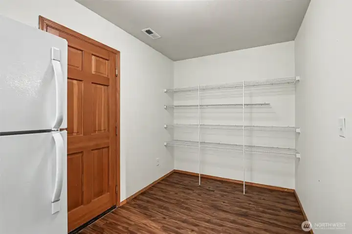 Massive pantry off the kitchen leads to 2 car garage.