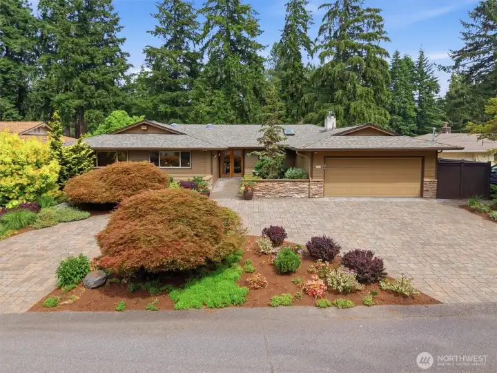 A convenient circular drive & lovely landscaping welcome you home.