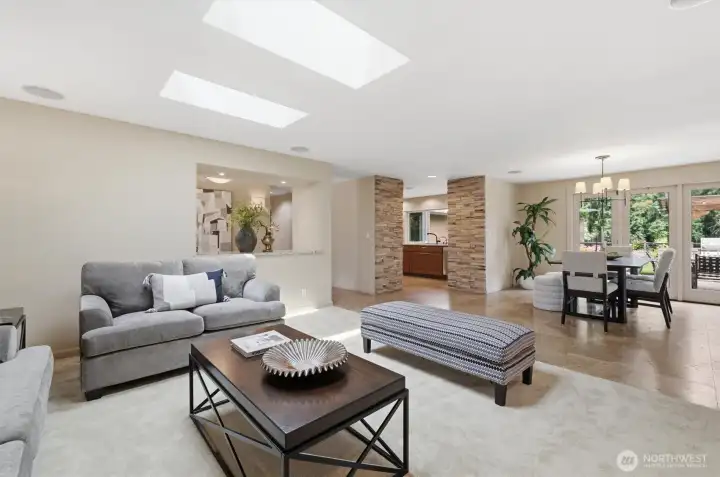 Step into open living & dining areas bathed with light from bright skylights.