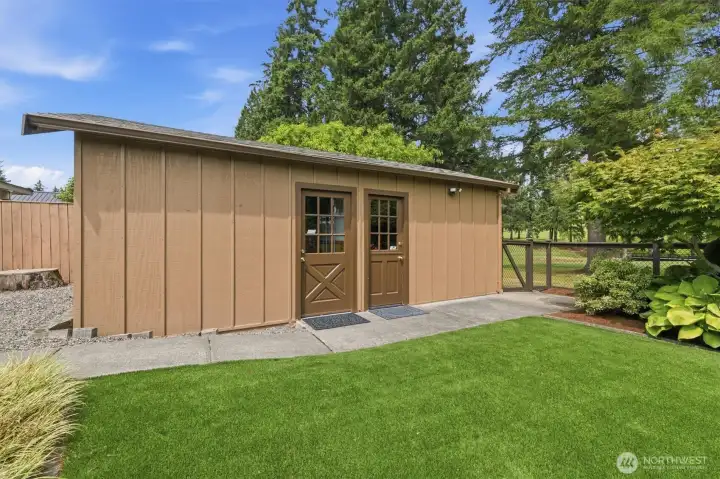 Shop on the left side & golf cart shed on the right.