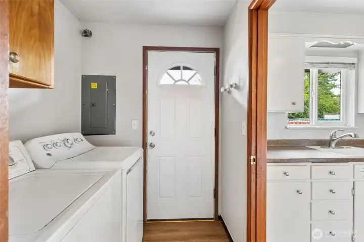 Utility/mud room with door to back patio.