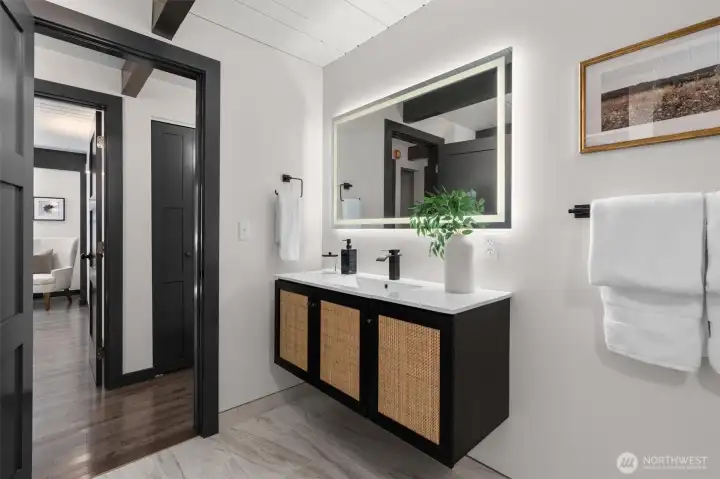 The main floor b bathroom has all of the same stunning features but also includes a direct access outside to the pad made for your hotub!