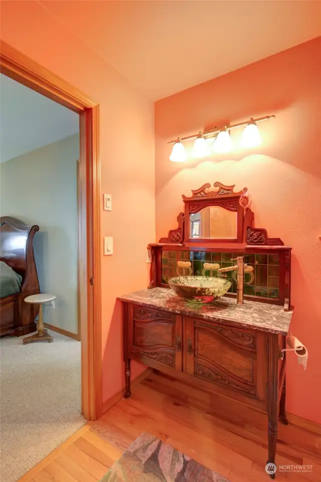 The custom antique vanity offers a special touch of whimsy.