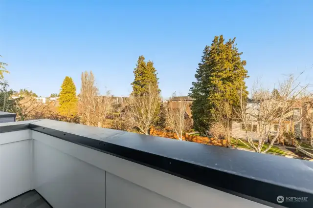 Enjoy tranquil tree-lined views from your balcony. This peaceful setting is perfect for soaking in the fresh air while still being in the heart of vibrant Ballard.