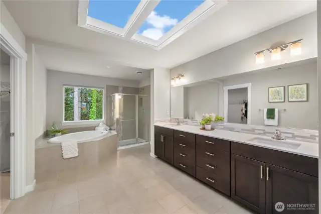 Head back inside to find your dreamy primary en-suite (check out the skylight!)