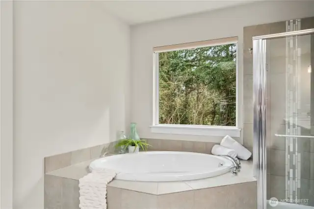 Soaking tub is just one of the many amazing features of this private en-suite