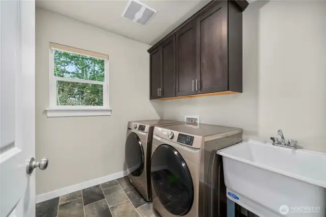 Upper level laundry room is a huge added convenience! Plus enjoy a handy utility sink!