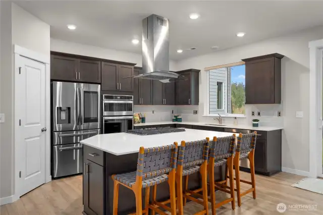 From the stainless steel appliances to the quartz counter tops, this kitchen is just as beautiful as it is functional!