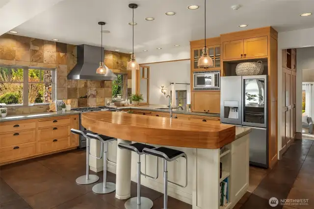 Large kitchen with a pass through window into the media room