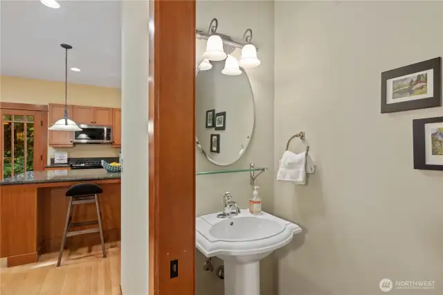 A powder bath is conveniently tucked away off to the side of the kitchen.