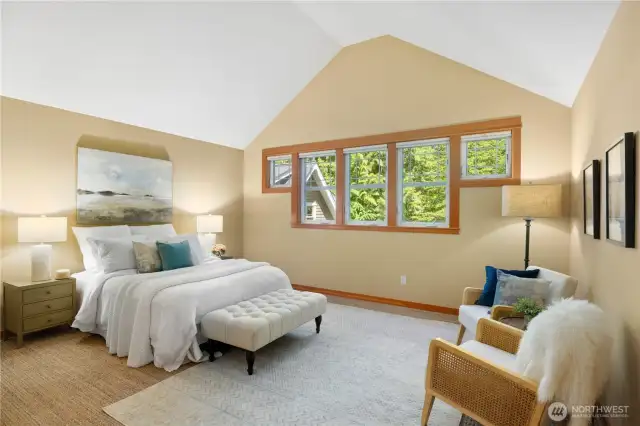 The gorgeous upstairs primary ensuite has vaulted ceilings, a generous walk-in closet, and luxe spa-like bath.