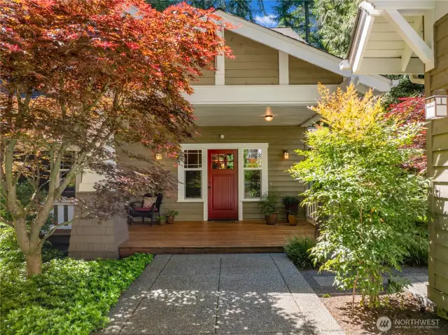 The welcoming entry is surrounded by gorgeous landscaping and a generous covered front porch.