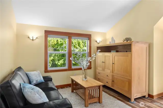 The detached ADU has a separate sitting and dining area and includes a full kitchen.  Sofa and cabinet shown here can be included in the sale.