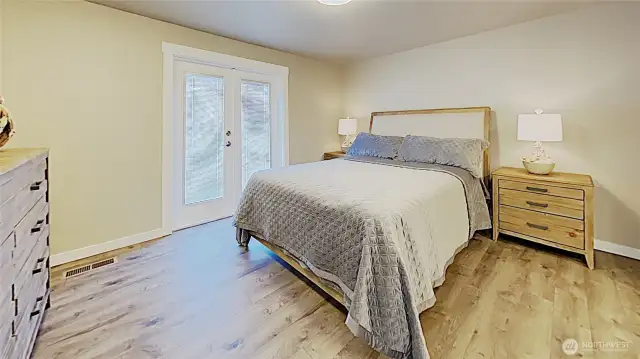 Master suite on main floor, with direct access to patio through french doors