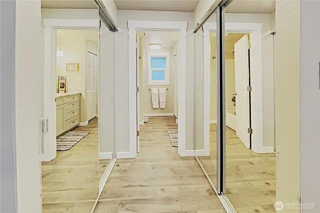 Master bathroom hallway, with mirrored closets on both sides