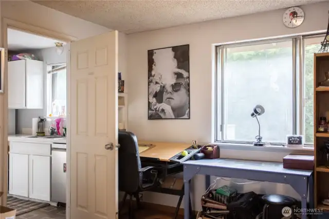 office space off the living room area on the main floor.  connects to kitchen