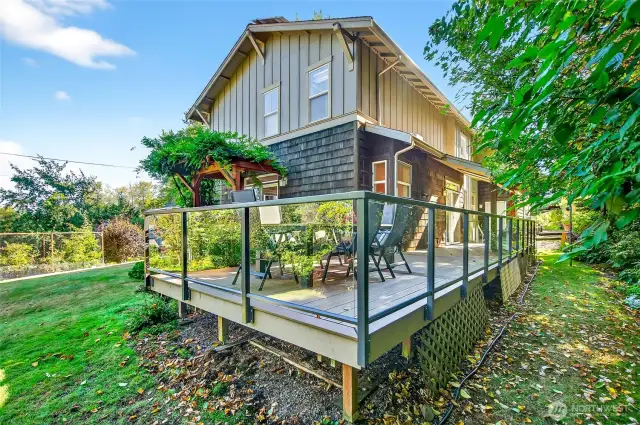 Large deck with Trex decking and glass siding.