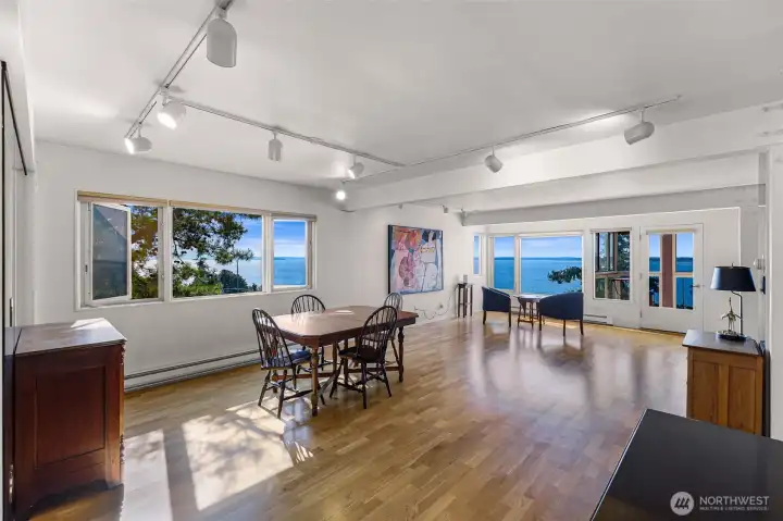 Large dining and open concept living gives plenty of options for arrangement to take in the water views from every living angle