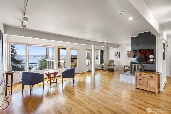 View from dining area into the main living, bright and open with water views from every angle