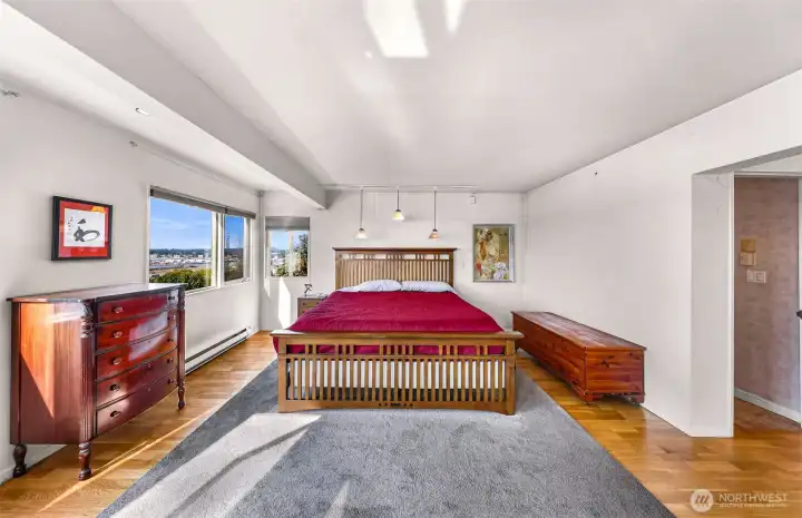 Sunroom leads to Primary bedroom, large spacious room filled with sunlight.