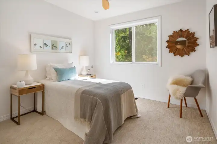 Upstairs bedroom with ceiling fan