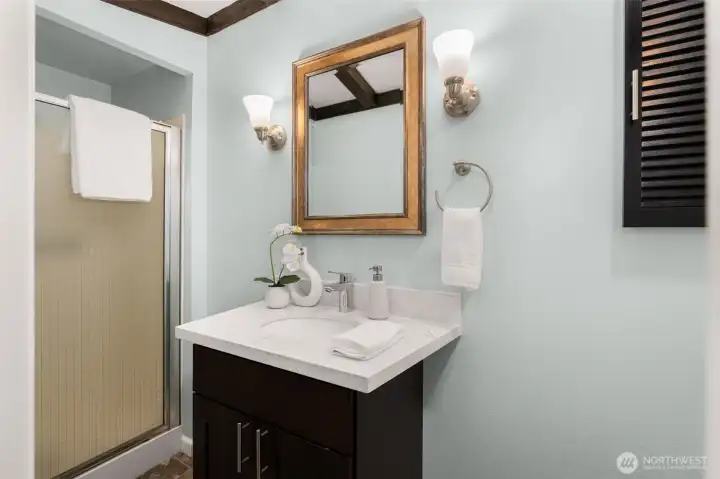 3/4 bath off lower level adjacent to bedroom.