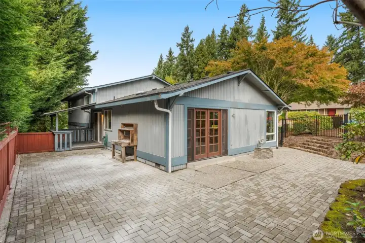 Expansive brick paver entertaining patio.
