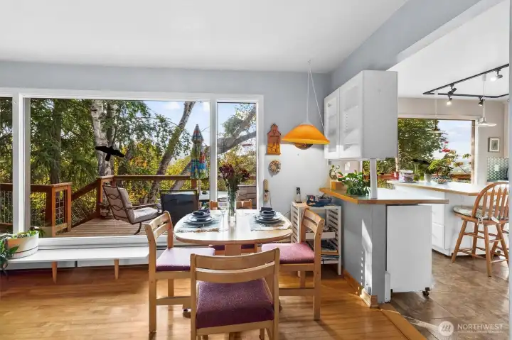 Dining space filled with light, offering direct access to the kitchen and living room for effortless entertaining.