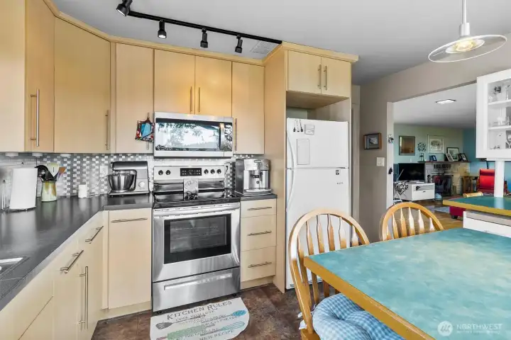 Functional kitchen design with stainless steel appliances, generous counter space, and storage options.