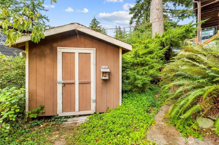 Detached storage shed ideal for tools, hobbies, or outdoor gear.