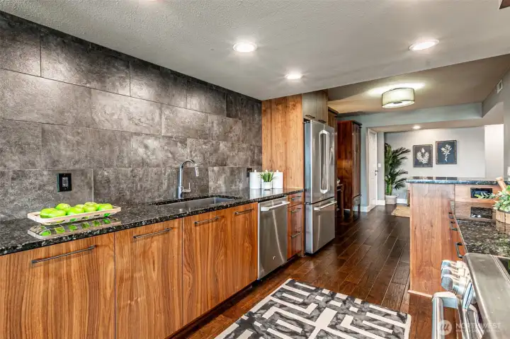Custom cabinets with pullouts.  Some welded open shelves, floating shelves or a favorite piece of art would look great on the tile wall.